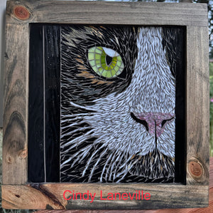granular mosaic of black and white cat using stained glass.